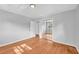 Bedroom features gleaming hardwood floors and closet with mirrored doors at 4331 E Kings Point Circle, Dunwoody, GA 30338