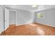 This bedroom with hardwood floors features neutral paint and lots of natural light at 4331 E Kings Point Circle, Dunwoody, GA 30338