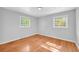 Cozy bedroom has hardwood floors and two windows to let in the natural light at 4331 E Kings Point Circle, Dunwoody, GA 30338