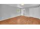 Spacious bedroom featuring hardwood floors, neutral walls, natural light, and a closet at 4331 E Kings Point Circle, Dunwoody, GA 30338