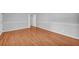 A spacious bedroom showcases gleaming hardwood floors, neutral paint, and updated trim at 4331 E Kings Point Circle, Dunwoody, GA 30338