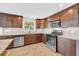 Renovated kitchen boasts stainless steel appliances, granite countertops, and modern backsplash at 4331 E Kings Point Circle, Dunwoody, GA 30338