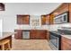 Modern kitchen features stainless steel appliances, granite countertops, and updated cabinets at 4331 E Kings Point Circle, Dunwoody, GA 30338