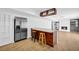 Modern open concept kitchen with a breakfast bar, stainless steel refrigerator, and stylish lighting at 4331 E Kings Point Circle, Dunwoody, GA 30338