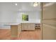 A charming kitchen features stone countertops, wood cabinets and hardwood floors at 4331 E Kings Point Circle, Dunwoody, GA 30338