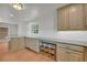 Charming kitchen features stone countertops, wood cabinets and hardwood floors at 4331 E Kings Point Circle, Dunwoody, GA 30338