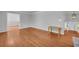 Open-concept living room boasts hardwood floors and neutral paint, leading to the foyer at 4331 E Kings Point Circle, Dunwoody, GA 30338