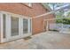 View of a home's backyard patio with direct entry to the inside at 4331 E Kings Point Circle, Dunwoody, GA 30338