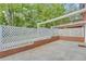 View of a home's backyard showing a patio with a privacy fence at 4331 E Kings Point Circle, Dunwoody, GA 30338