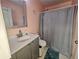 Bathroom featuring a modern vanity, stylish fixtures, and a shower with a gray curtain at 5536 Strathmoor Manor Cir, Lithonia, GA 30058