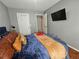 Comfortable bedroom featuring a modern bed, wall-mounted television, and ensuite at 5536 Strathmoor Manor Cir, Lithonia, GA 30058
