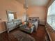 Inviting bedroom with a decorative chandelier, silver furniture, and hardwood floors at 5536 Strathmoor Manor Cir, Lithonia, GA 30058