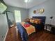Comfortable bedroom featuring a modern bed, decorative art, and a full-length mirror at 5536 Strathmoor Manor Cir, Lithonia, GA 30058