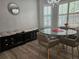 Cozy dining area with a round glass table, seating, and bright natural light at 5536 Strathmoor Manor Cir, Lithonia, GA 30058