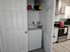 Convenient laundry closet with washer located in the kitchen, offering easy access at 5536 Strathmoor Manor Cir, Lithonia, GA 30058