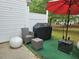 Outdoor patio area with furniture, grill and umbrella, perfect for relaxing and entertaining at 5536 Strathmoor Manor Cir, Lithonia, GA 30058