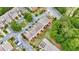An aerial shot displays neat townhomes with private patios and manicured lawns at 7812 Kiverton Pl, Atlanta, GA 30350