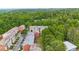 Scenic aerial view of a townhome community surrounded by dense, mature trees at 7812 Kiverton Pl, Atlanta, GA 30350