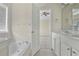 Bathroom features dual sinks, soaking tub, and is adjacent to the main bedroom at 7812 Kiverton Pl, Atlanta, GA 30350