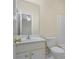 Clean bathroom featuring white fixtures, a large mirror, and ceramic tile floor at 7812 Kiverton Pl, Atlanta, GA 30350