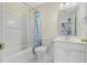 Clean, well-lit bathroom with shower-tub combo, toilet, and vanity at 7812 Kiverton Pl, Atlanta, GA 30350