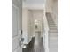 Inviting foyer with hardwood floors, staircase, and neutral paint, leading to the home's interior at 7812 Kiverton Pl, Atlanta, GA 30350