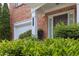 Close-up of a red brick home with an attached garage and inviting front entryway at 7812 Kiverton Pl, Atlanta, GA 30350