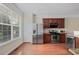 Bright kitchen has stainless steel appliances, granite countertops, and wood cabinets at 7812 Kiverton Pl, Atlanta, GA 30350