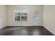 Bright room featuring wood floors, a window and back door to the exterior at 7812 Kiverton Pl, Atlanta, GA 30350