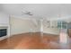 Inviting living area with hardwood floors, a fireplace, and an open layout at 7812 Kiverton Pl, Atlanta, GA 30350