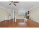 Open-concept living space featuring hardwood floors, neutral tones, and ample natural light at 7812 Kiverton Pl, Atlanta, GA 30350