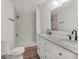 Modern bathroom features a double vanity, granite counters and a tiled walk-in shower at 117 Spring St, Stockbridge, GA 30281