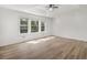 Sun-filled bedroom with stylish flooring, and three large windows offering ample natural light at 117 Spring St, Stockbridge, GA 30281
