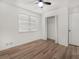 This bedroom features hardwood floors, a ceiling fan and a spacious closet at 117 Spring St, Stockbridge, GA 30281