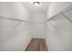 Walk-in closet with built-in shelving is move-in ready at 117 Spring St, Stockbridge, GA 30281