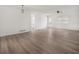 Spacious, open-concept living area featuring light-colored wood floors and neutral walls at 117 Spring St, Stockbridge, GA 30281