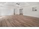 Open-concept living room features new hardwood floors and bright white walls at 117 Spring St, Stockbridge, GA 30281