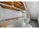 Unfinished basement area shows exposed HVAC, concrete floor and brick walls at 2703 Flagstone Se Dr, Atlanta, GA 30316