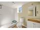 Bathroom featuring a tiled shower, toilet, and vanity with sink at 2703 Flagstone Se Dr, Atlanta, GA 30316
