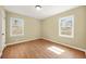 This bedroom features hardwood floors and two windows at 2703 Flagstone Se Dr, Atlanta, GA 30316