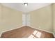This bedroom includes hardwood floors and white doors at 2703 Flagstone Se Dr, Atlanta, GA 30316