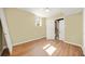 Bright room featuring hardwood flooring, a window letting in natural light and a door leading to an unfinished space at 2703 Flagstone Se Dr, Atlanta, GA 30316