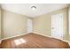 This bedroom includes hardwood floors, a ceiling light, and white doors at 2703 Flagstone Se Dr, Atlanta, GA 30316