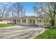 Exterior of the home featuring a covered parking area and well-maintained lawn at 2703 Flagstone Se Dr, Atlanta, GA 30316
