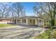 Exterior of the home featuring a covered parking area and well-maintained lawn at 2703 Flagstone Se Dr, Atlanta, GA 30316