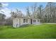 Quaint one-story home with a well-manicured lawn and mature trees offering shade at 2703 Flagstone Se Dr, Atlanta, GA 30316