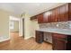 Efficient kitchen area featuring hardwood floors and dark cabinets at 2703 Flagstone Se Dr, Atlanta, GA 30316