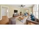 Cozy living room with hardwood floors, plush seating, and large windows at 2703 Flagstone Se Dr, Atlanta, GA 30316
