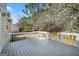 Enjoy backyard views from this home's wooden deck at 3813 Nowlin Nw Rd, Kennesaw, GA 30144