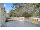 Spacious wooden back deck, perfect for entertaining, with white railing overlooking a treed backyard at 3813 Nowlin Nw Rd, Kennesaw, GA 30144